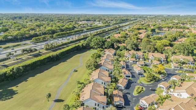 birds eye view of property with a residential view and a water view