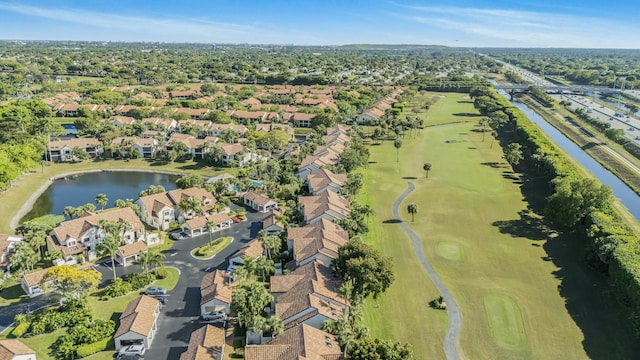 bird's eye view featuring a water view, view of golf course, and a residential view