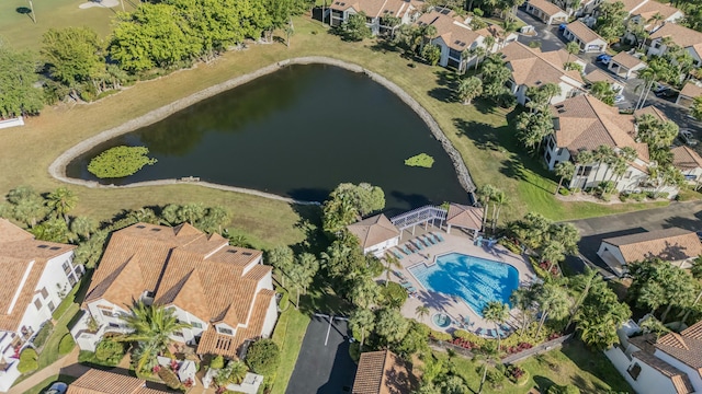 drone / aerial view with a water view and a residential view