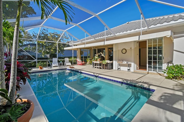 pool featuring a lanai and a patio