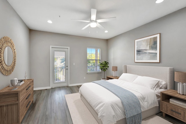 bedroom with access to exterior, dark wood-type flooring, baseboards, ceiling fan, and recessed lighting