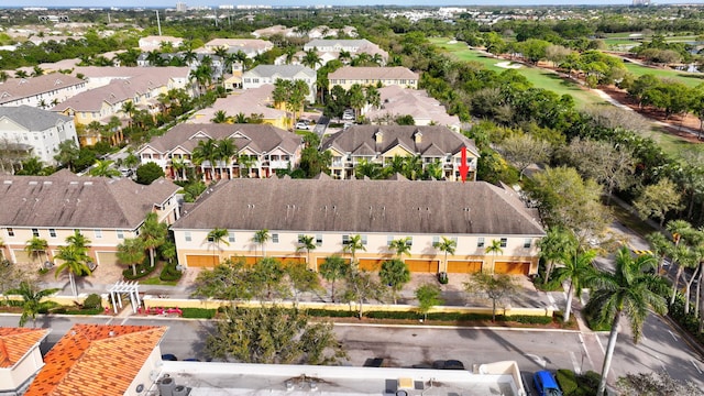 birds eye view of property with a residential view