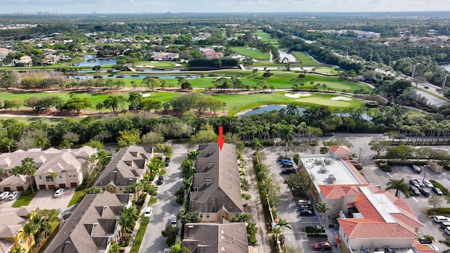 bird's eye view with a residential view, a water view, and view of golf course