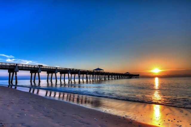 dock area featuring a pier and a water view