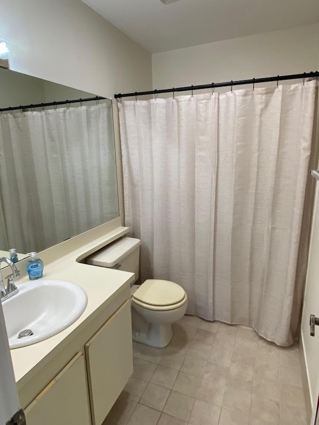 full bath with toilet and vanity