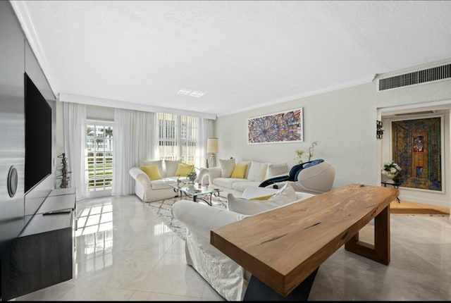 living room with visible vents and crown molding