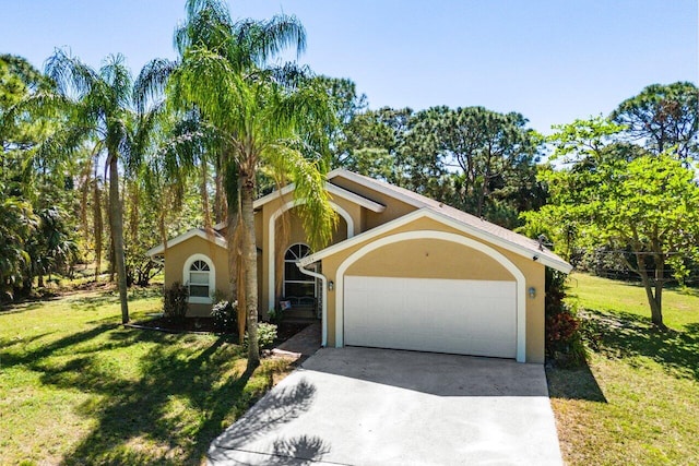 view of front of property featuring a garage, concrete driveway, a front lawn, and stucco siding