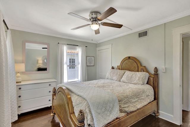 bedroom featuring visible vents, crown molding, ceiling fan, baseboards, and dark wood-style floors