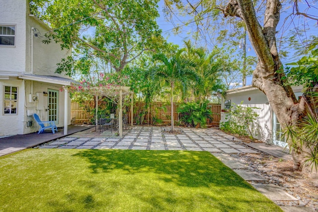 view of yard featuring a patio and fence