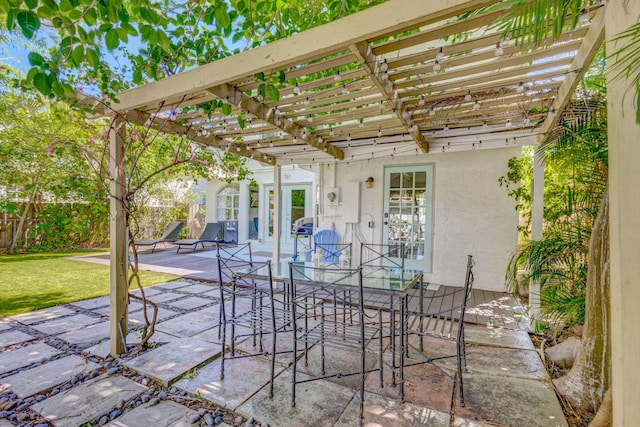 view of patio / terrace with fence and a pergola