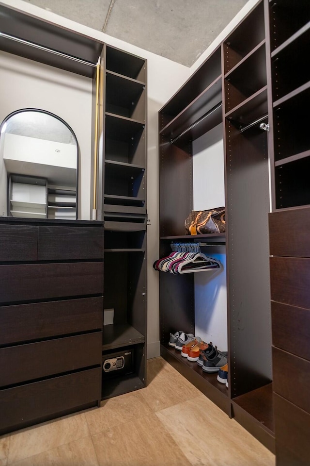 spacious closet featuring tile patterned flooring