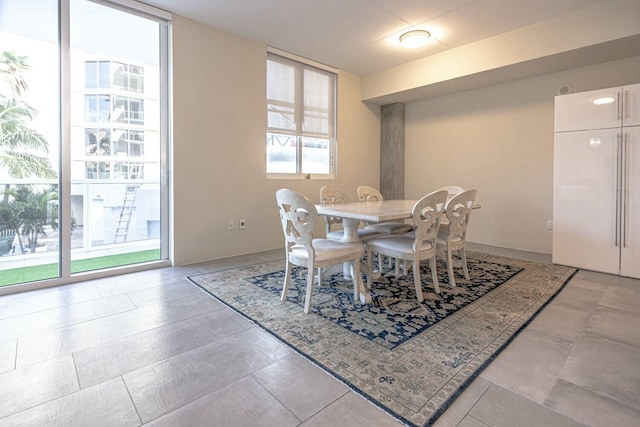 dining area with a wall of windows