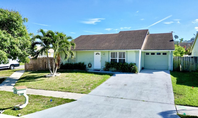 view of front of home featuring stucco siding, an attached garage, a front yard, fence, and driveway