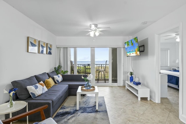 living area with a ceiling fan