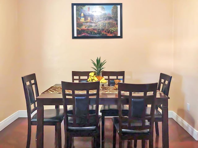 dining space featuring baseboards