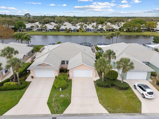 drone / aerial view featuring a water view and a residential view