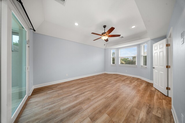 unfurnished room with recessed lighting, light wood-type flooring, and baseboards