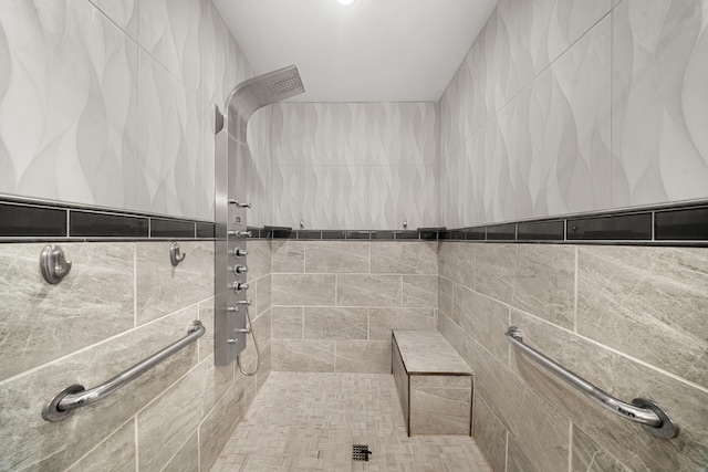 full bathroom with tiled shower