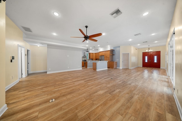 unfurnished living room with light wood-type flooring, visible vents, and recessed lighting