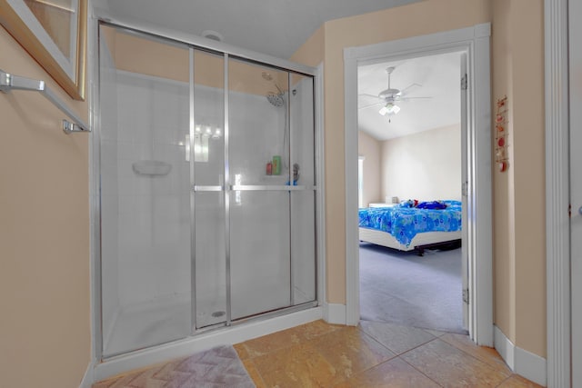 ensuite bathroom featuring ceiling fan, tile patterned flooring, connected bathroom, and a shower stall