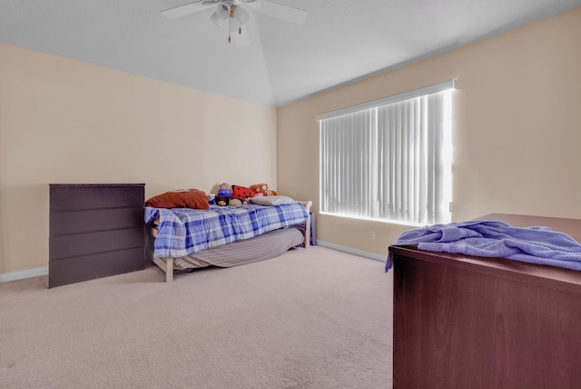 bedroom featuring lofted ceiling, carpet floors, ceiling fan, and baseboards