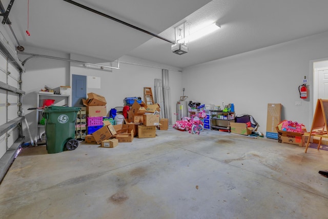 garage featuring a garage door opener and electric panel