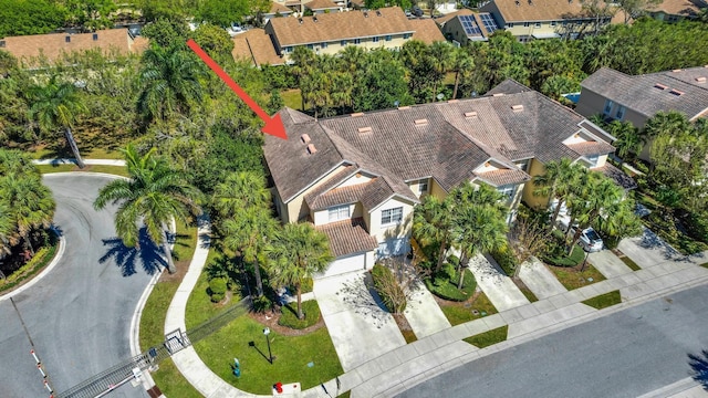 birds eye view of property with a residential view