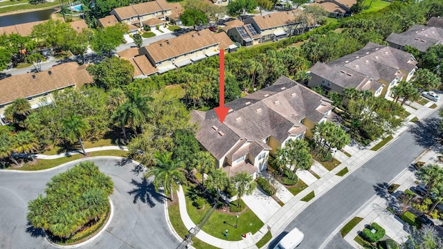 bird's eye view featuring a residential view and a water view