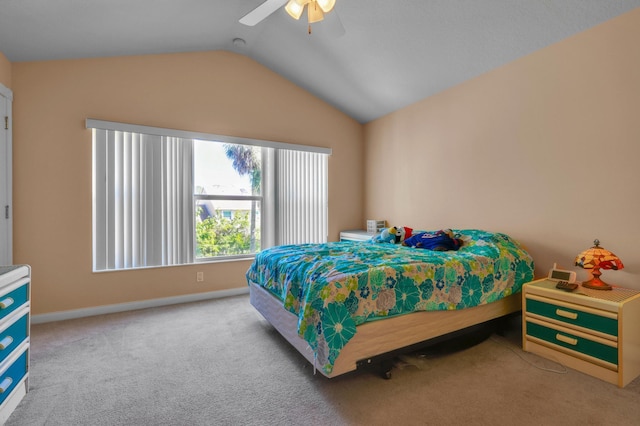 carpeted bedroom with lofted ceiling, ceiling fan, and baseboards