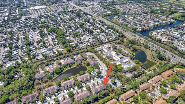 bird's eye view featuring a water view and a residential view