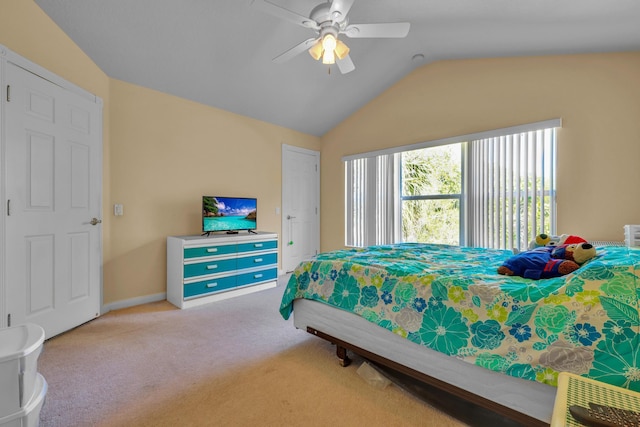 carpeted bedroom featuring lofted ceiling, ceiling fan, and baseboards