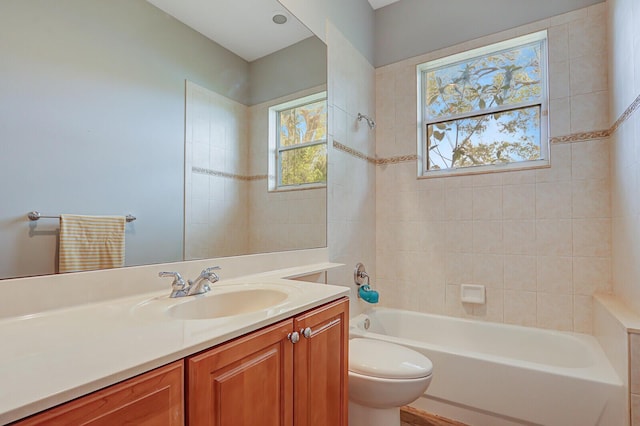 bathroom featuring vanity, bathing tub / shower combination, and toilet