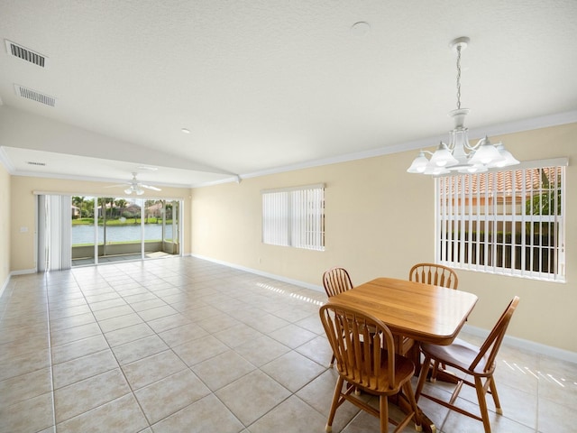 dining area featuring ornamental molding, visible vents, and light tile patterned flooring