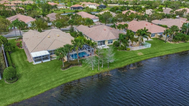 bird's eye view with a residential view and a water view