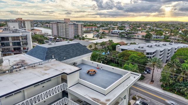 aerial view featuring a view of city and a water view