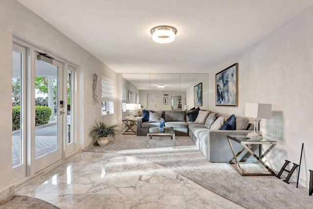 living room with marble finish floor and baseboards