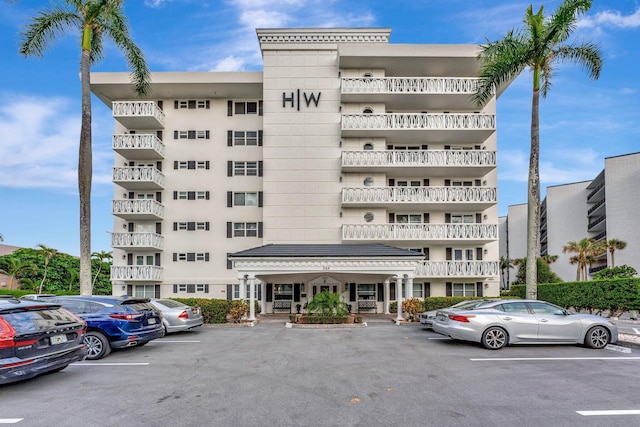 view of property featuring uncovered parking