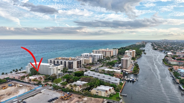 aerial view featuring a water view and a city view