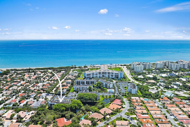 birds eye view of property featuring a view of city and a water view