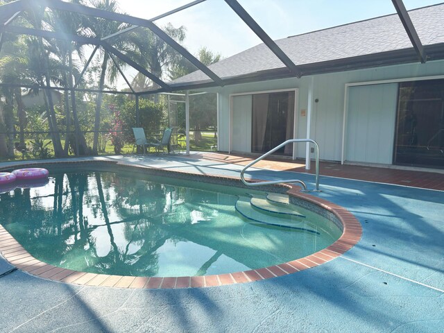 1826 SW Stratford Way, Palm City, FL 34990 - outdoor pool with a patio and glass enclosure