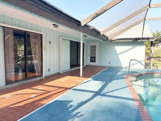 1826 SW Stratford Way, Palm City, FL 34990 - view of patio / terrace featuring an outdoor pool, glass enclosure, and a wooden deck