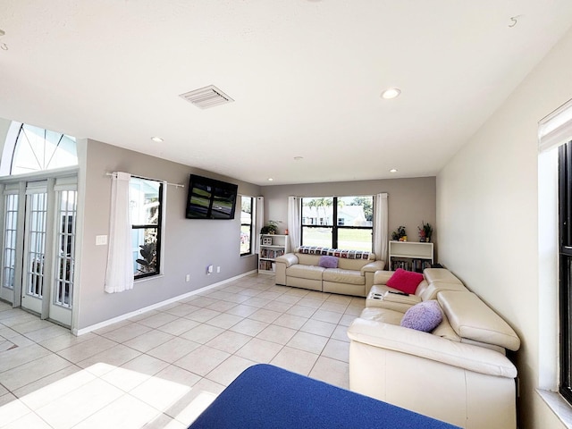 1826 SW Stratford Way, Palm City, FL 34990 - living area with light tile patterned floors, recessed lighting, and baseboards
