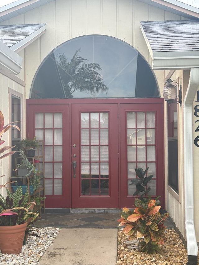 view of exterior entry featuring french doors