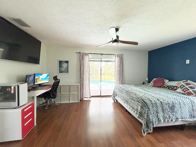 1826 SW Stratford Way, Palm City, FL 34990 - bedroom with wood finished floors, access to outside, a desk, a textured ceiling, and ceiling fan