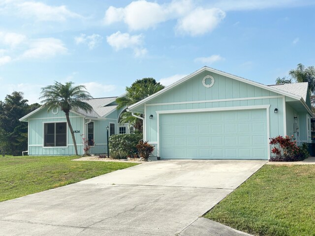 1826 SW Stratford Way, Palm City, FL 34990 - ranch-style house featuring a front yard, concrete driveway, and a garage