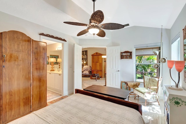 bedroom with ensuite bath, lofted ceiling, and a ceiling fan