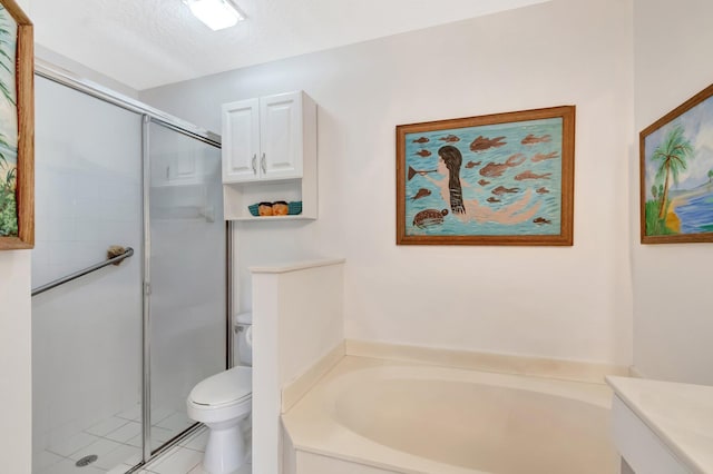 full bathroom featuring tile patterned flooring, a shower stall, toilet, a garden tub, and a textured ceiling