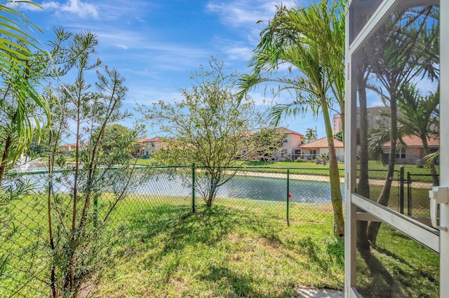 view of water feature featuring a residential view and fence