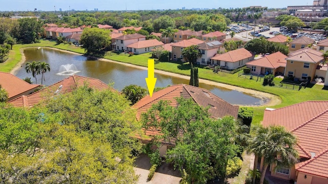 drone / aerial view with a residential view and a water view