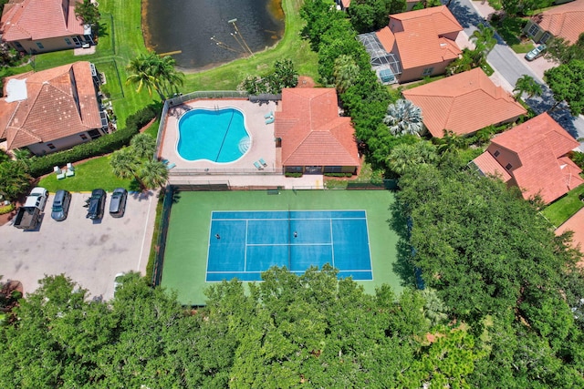 birds eye view of property featuring a water view